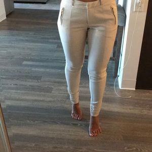 Taupe slacks with gold zippers